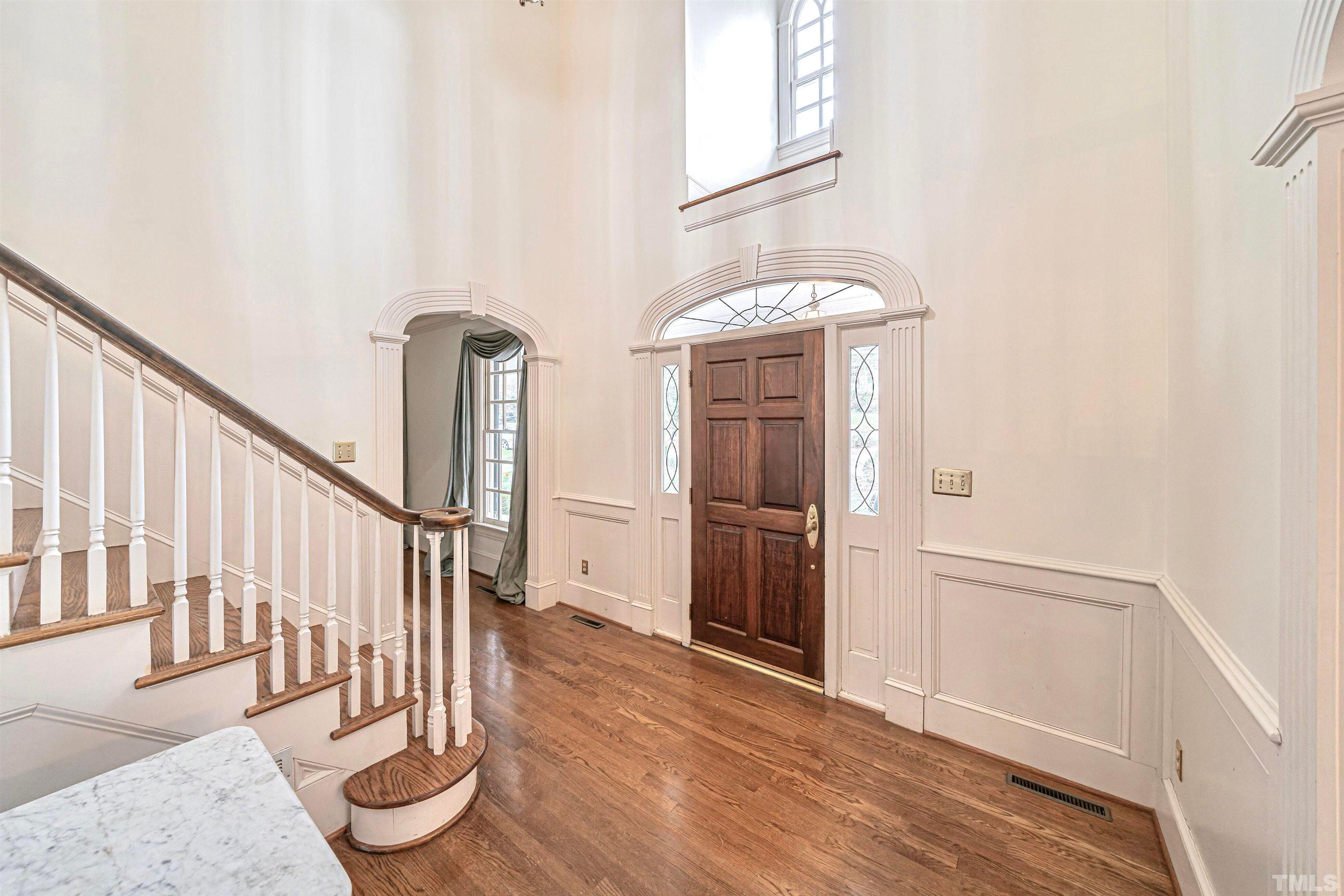 709 Runnymede Road Raleigh, NC 27607 - Photo 6 of 50 a view of entryway and hall with wooden floor