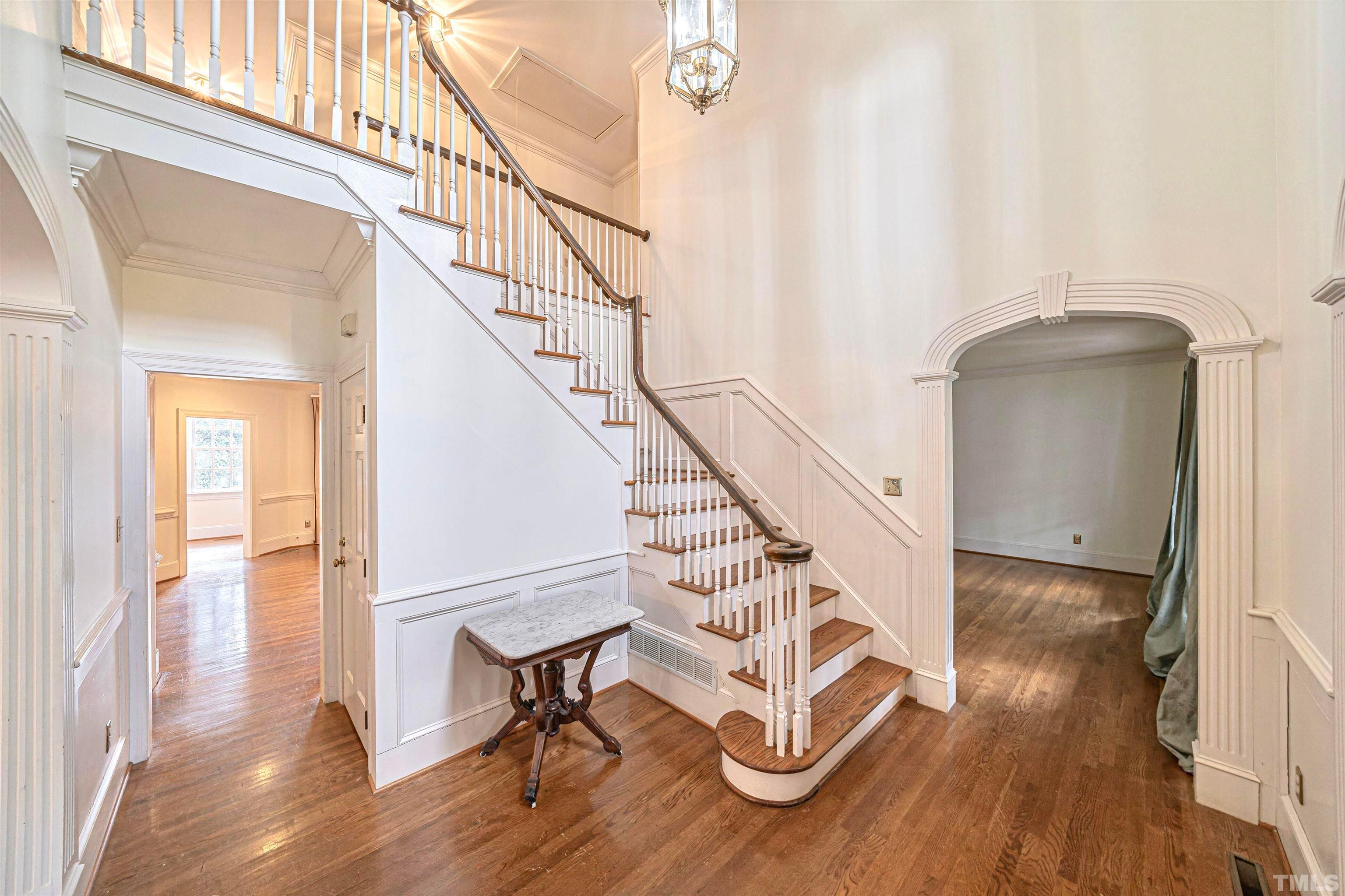 709 Runnymede Road Raleigh, NC 27607 - Photo 7 of 50 a view of entryway and hall with wooden floor
