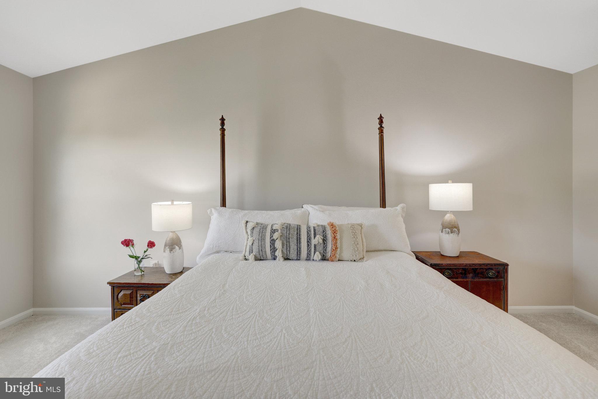 73 McPherson Circle Sterling, VA 20165 - Photo 32 of 74 a bedroom with a bed and a lamp