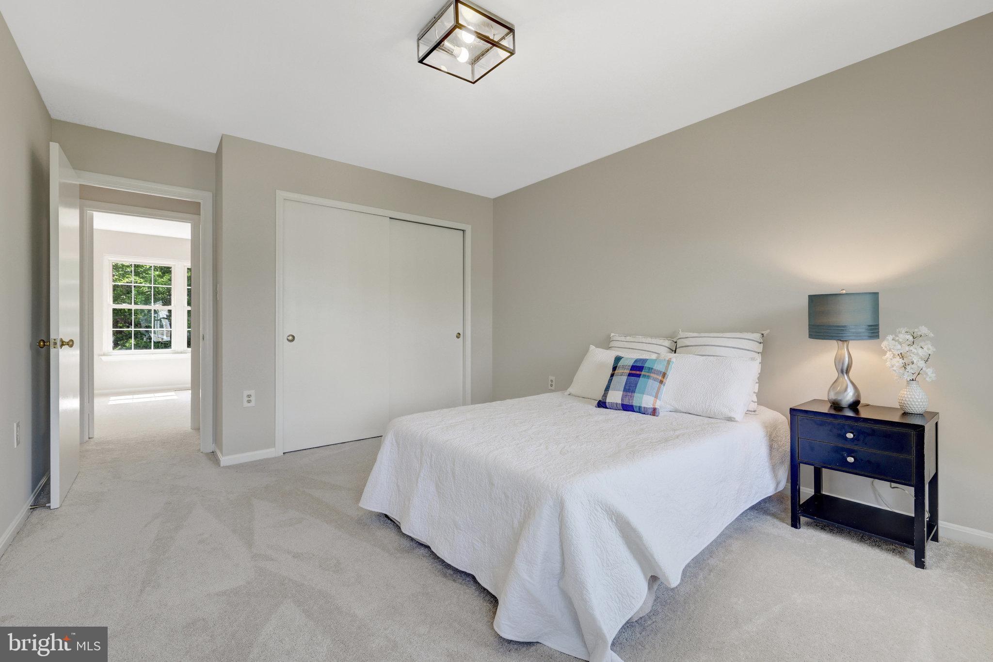 73 McPherson Circle Sterling, VA 20165 - Photo 46 of 74 a bedroom with a bed and a table