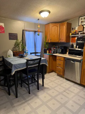 a kitchen with a cabinets and appliances