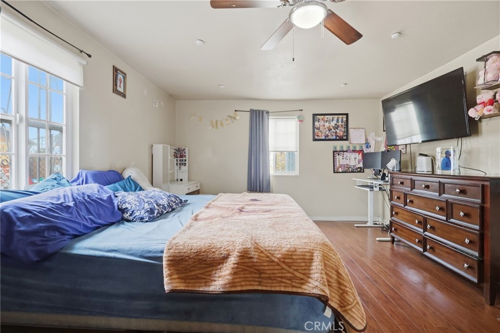 440 West Cherry Street Compton, CA 90222 - Photo 21 of 28 a bedroom with a bed and a flat screen tv