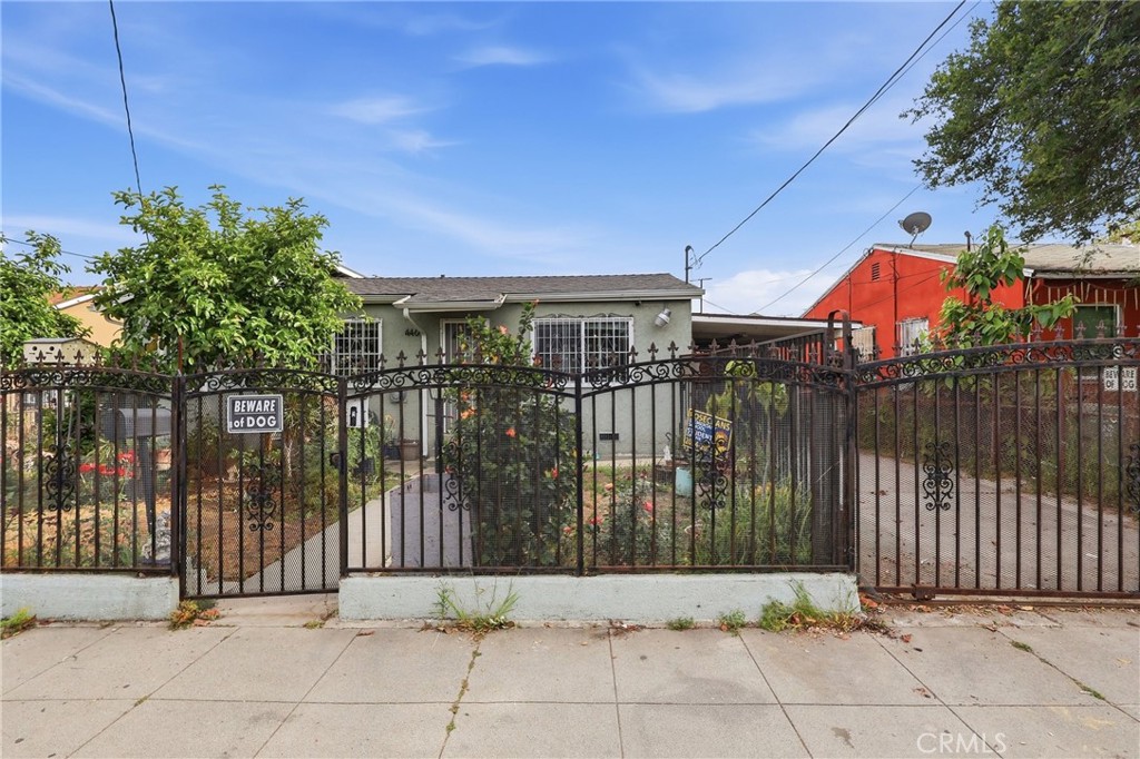 440 West Cherry Street Compton, CA 90222 - Photo 24 of 28 a backyard of a house with lots of green space and wooden fence