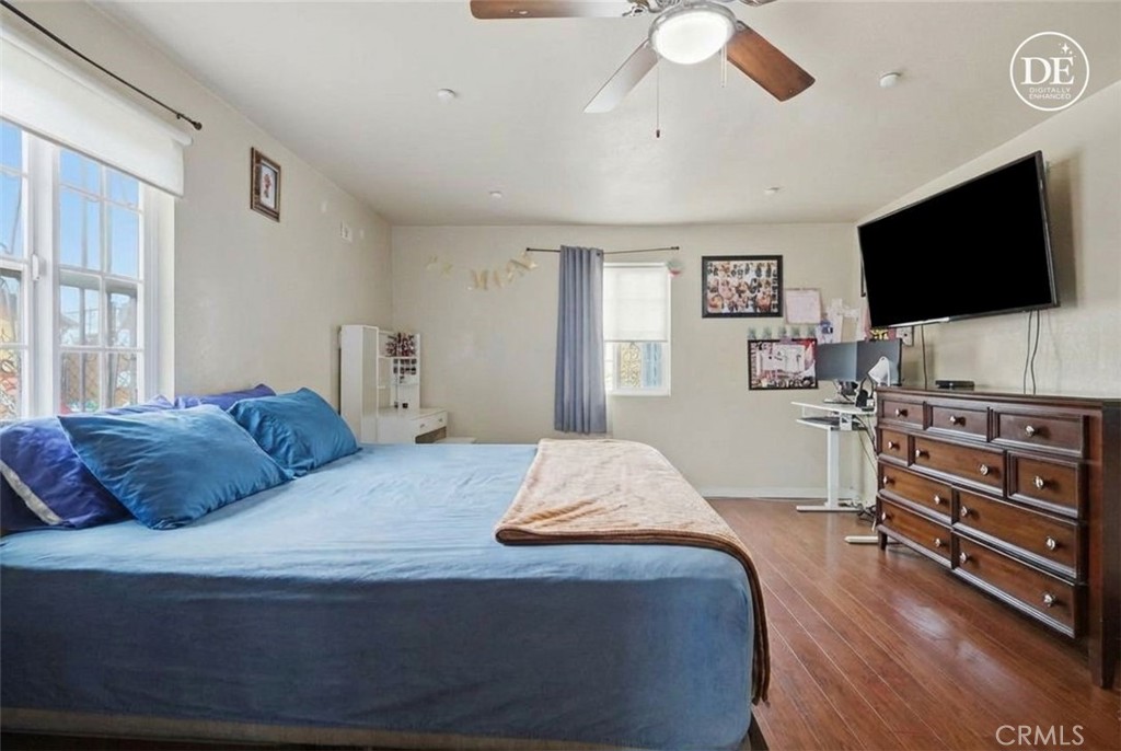 440 West Cherry Street Compton, CA 90222 - Photo 6 of 28 a bedroom with a bed and a flat screen tv