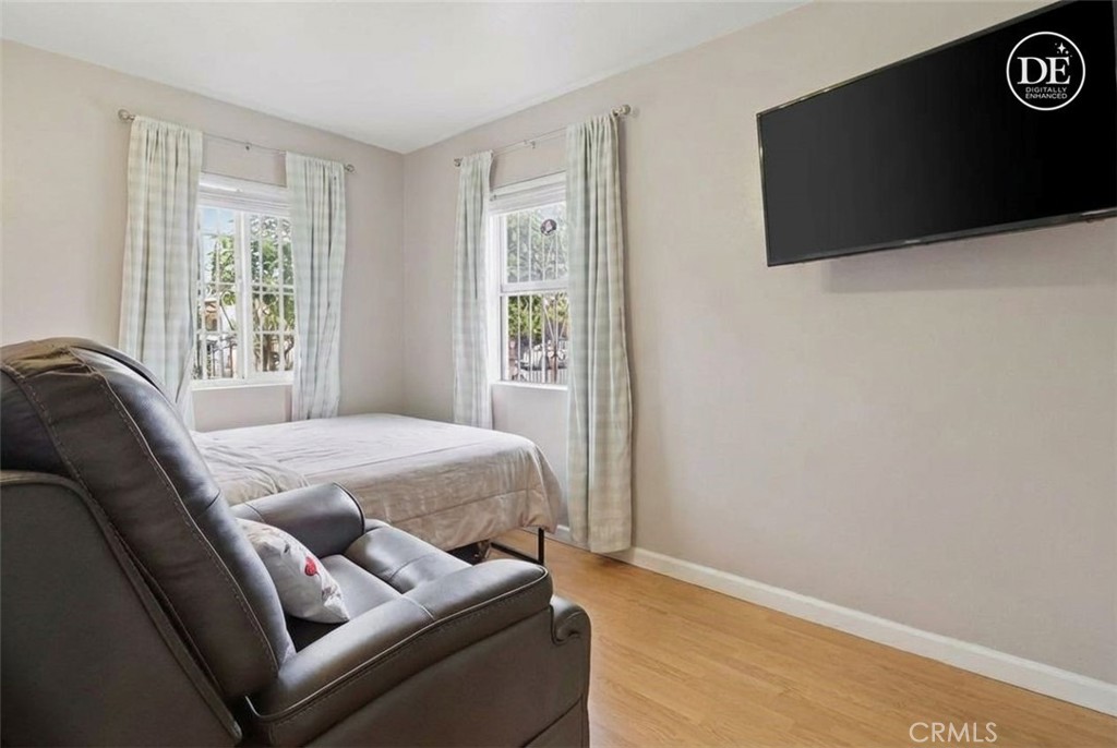 440 West Cherry Street Compton, CA 90222 - Photo 7 of 28 a bedroom with a bed and a flat screen tv