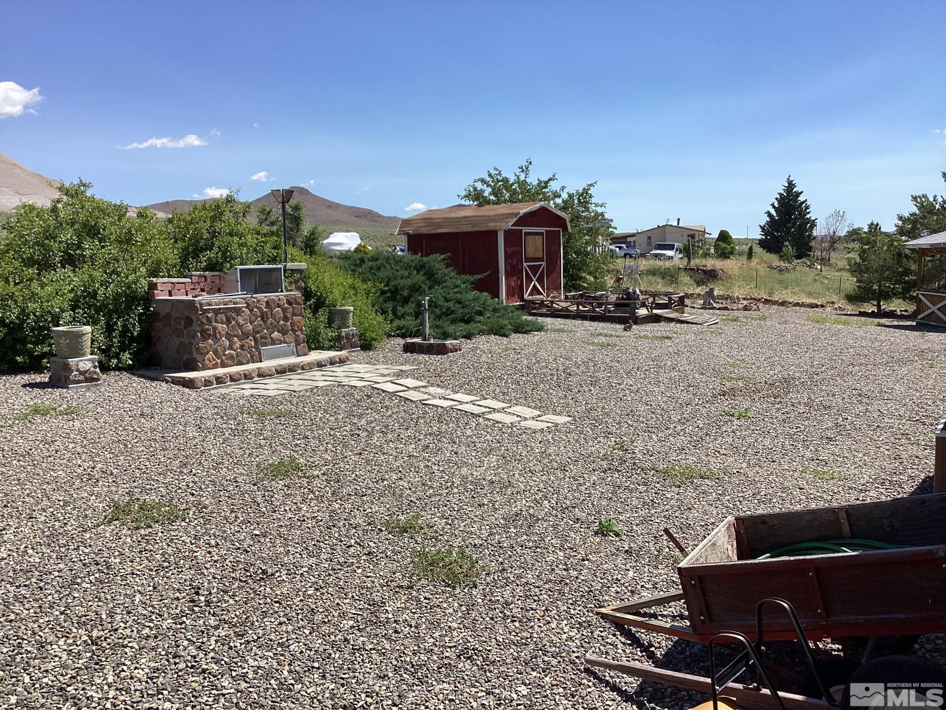 217 Territory Road Dayton, NV 89403 - Photo 11 of 15 a view of a house with backyard and sitting area