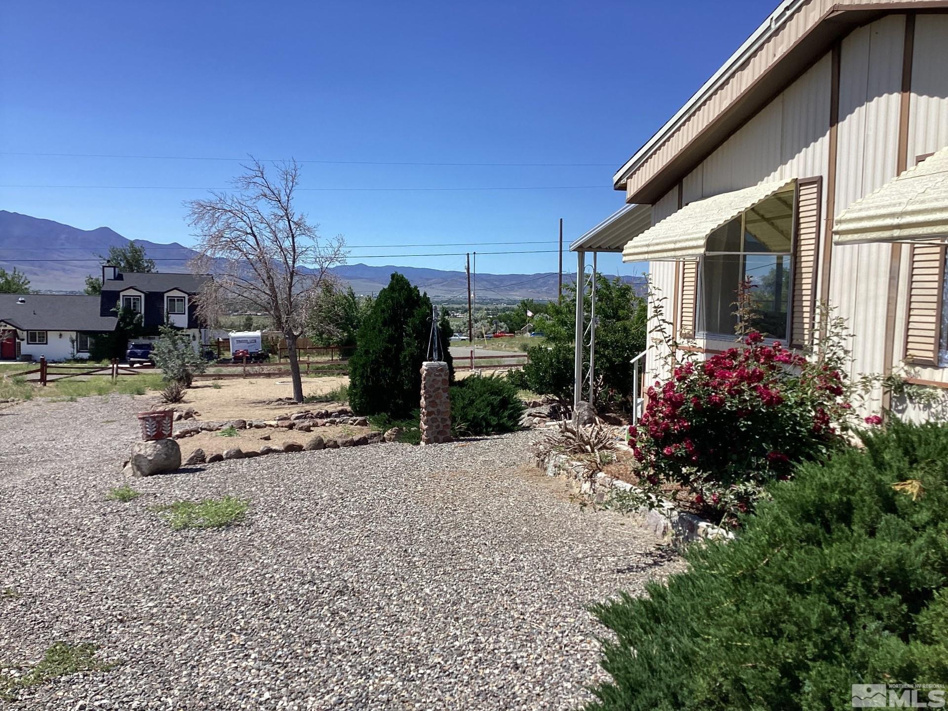217 Territory Road Dayton, NV 89403 - Photo 4 of 15 a front view of a house with garden