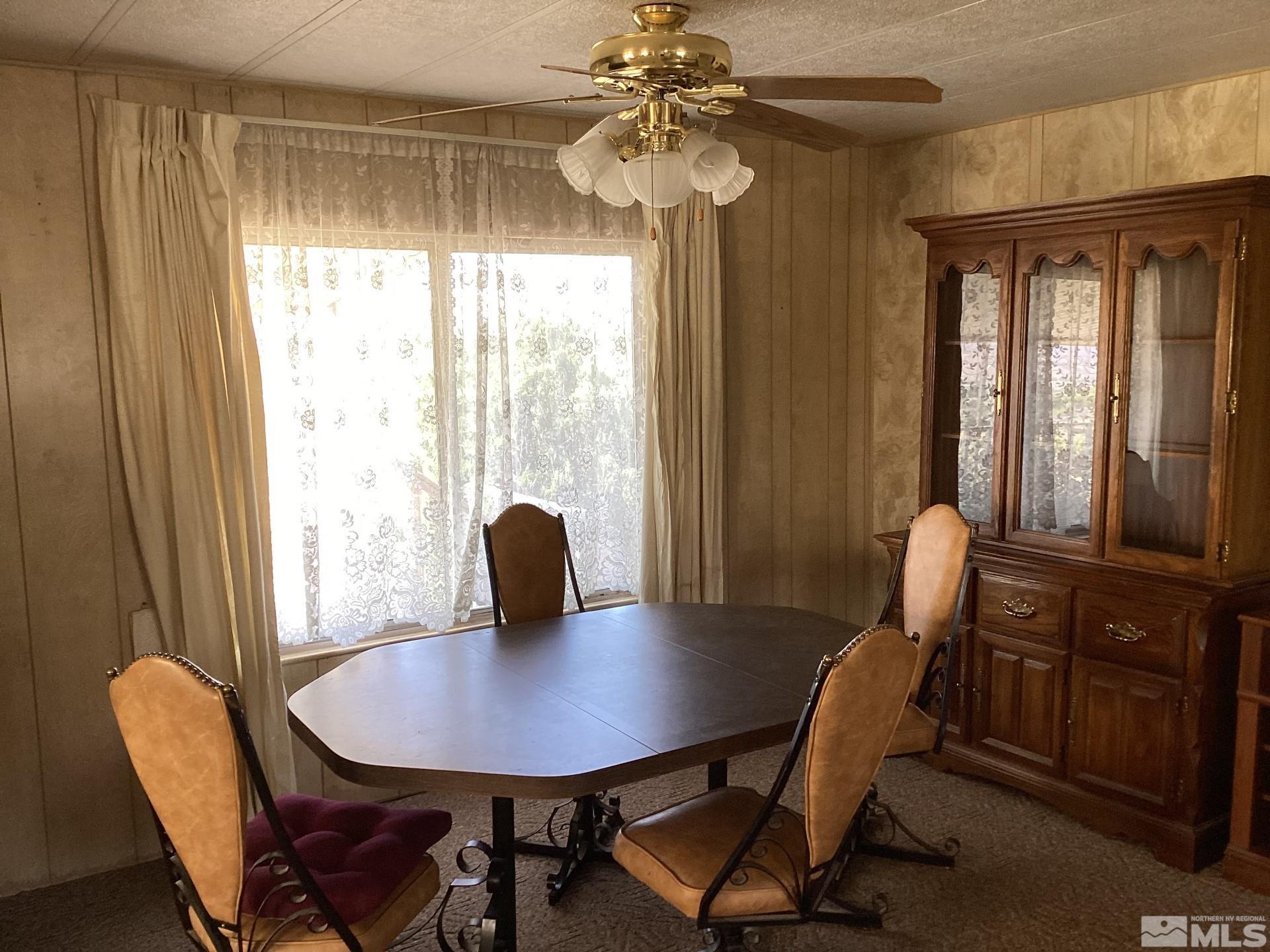 217 Territory Road Dayton, NV 89403 - Photo 8 of 15 a view of a dining room with furniture window and outside view