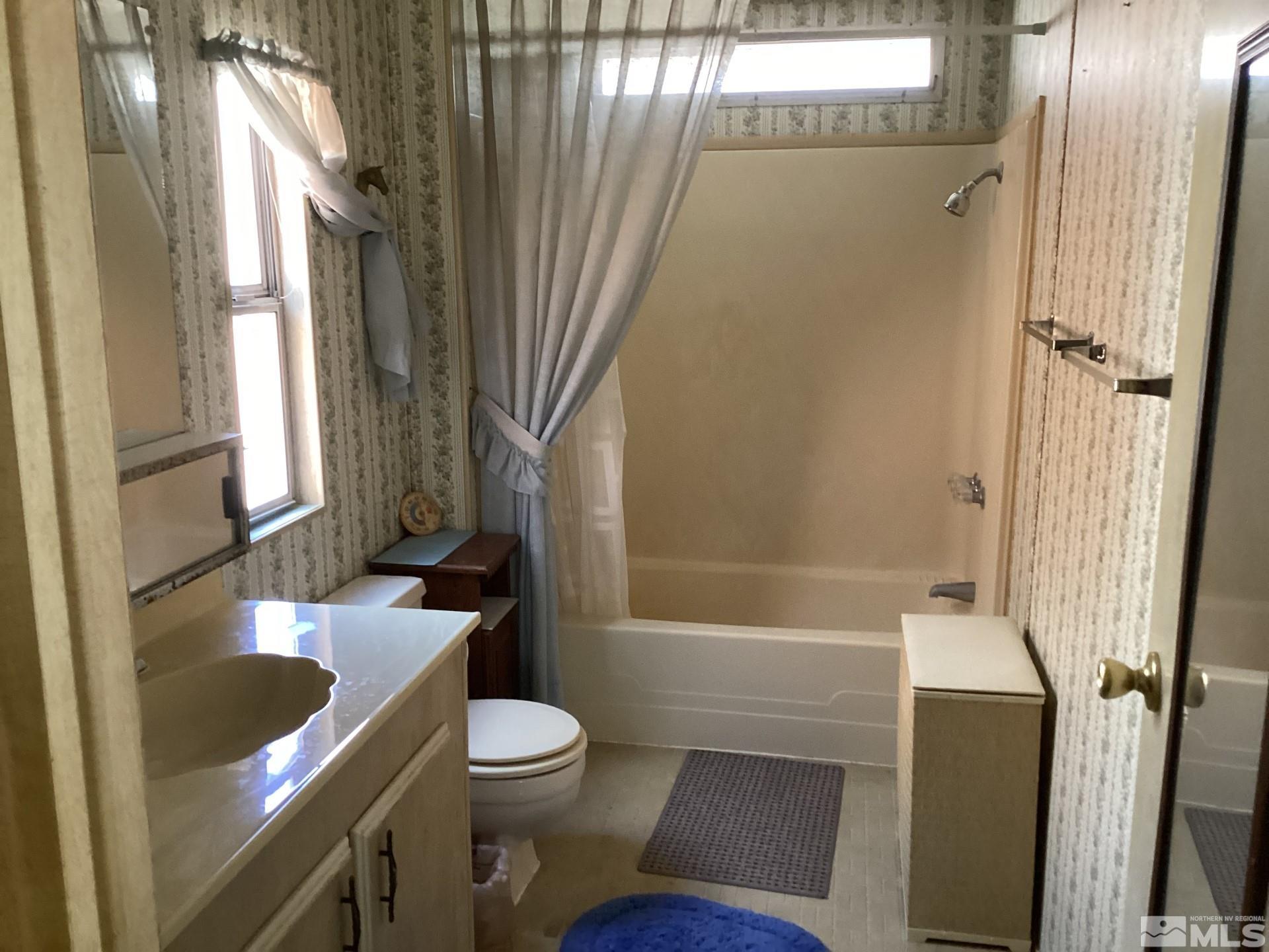 217 Territory Road Dayton, NV 89403 - Photo 10 of 15 a bathroom with a sink toilet and shower