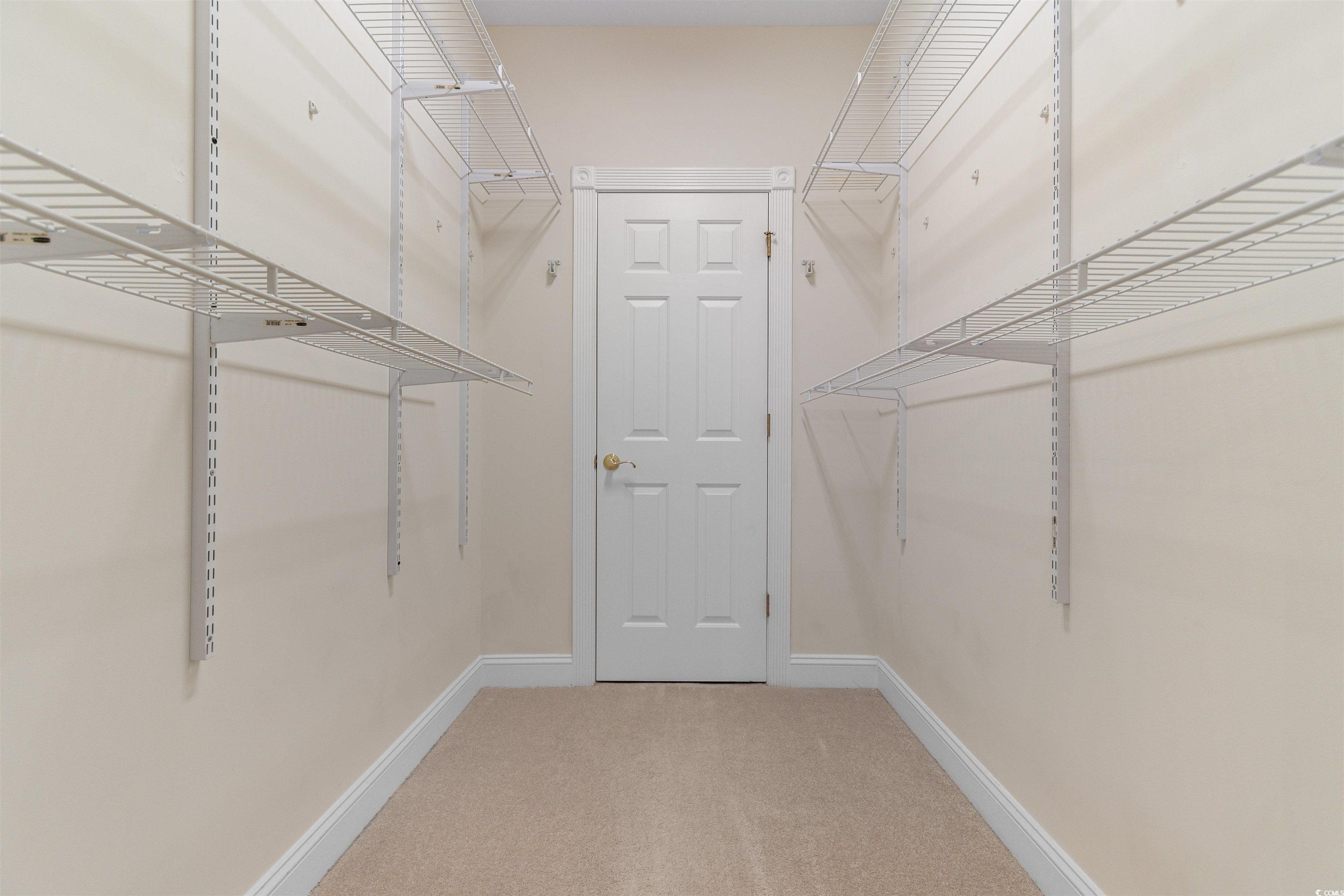 4875 Luster Leaf Circle, Unit 202 Myrtle Beach, SC 29577 - Photo 16 of 40 Spacious closet featuring carpet floors