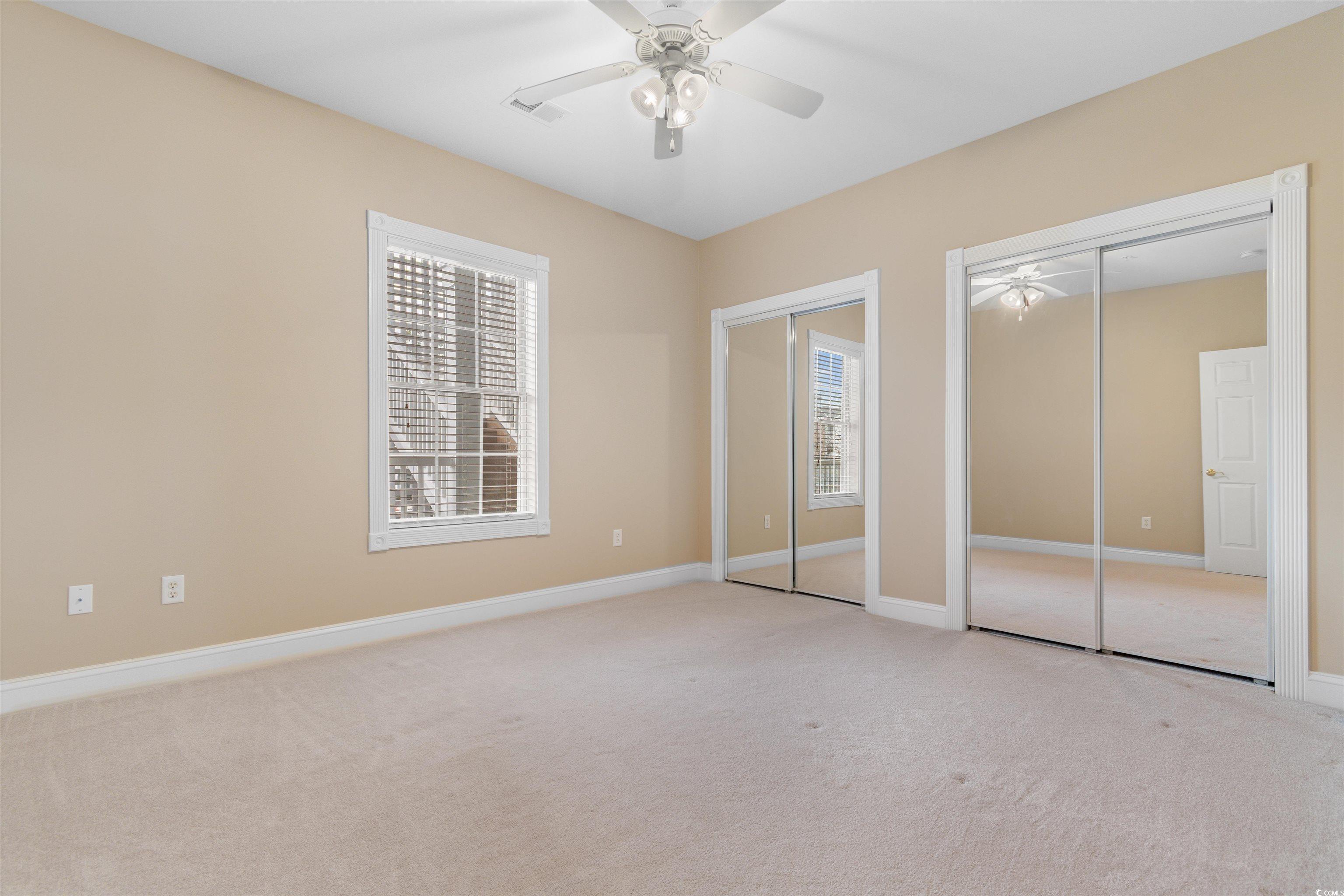 4875 Luster Leaf Circle, Unit 202 Myrtle Beach, SC 29577 - Photo 17 of 40 Unfurnished bedroom with visible vents, baseboards