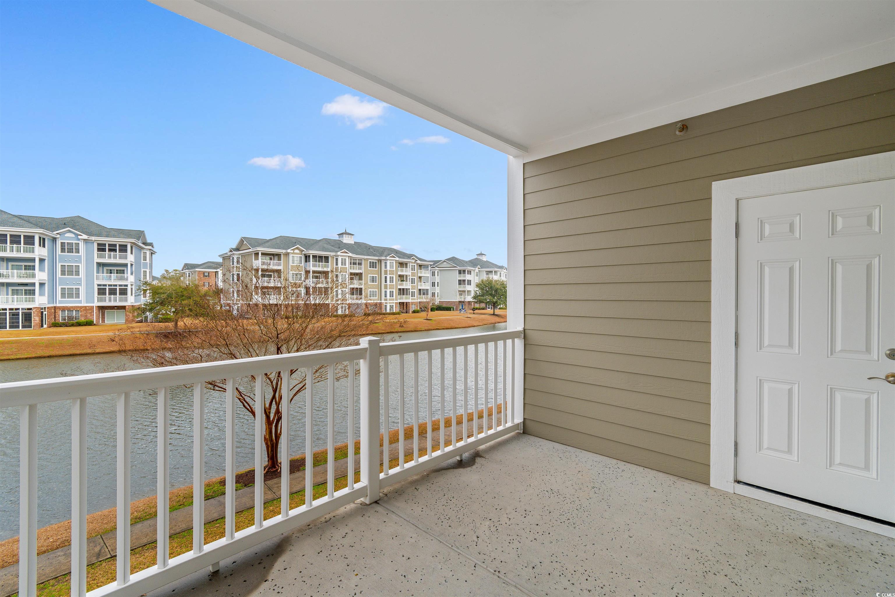 4875 Luster Leaf Circle, Unit 202 Myrtle Beach, SC 29577 - Photo 25 of 40 Balcony featuring a water view and a residential v