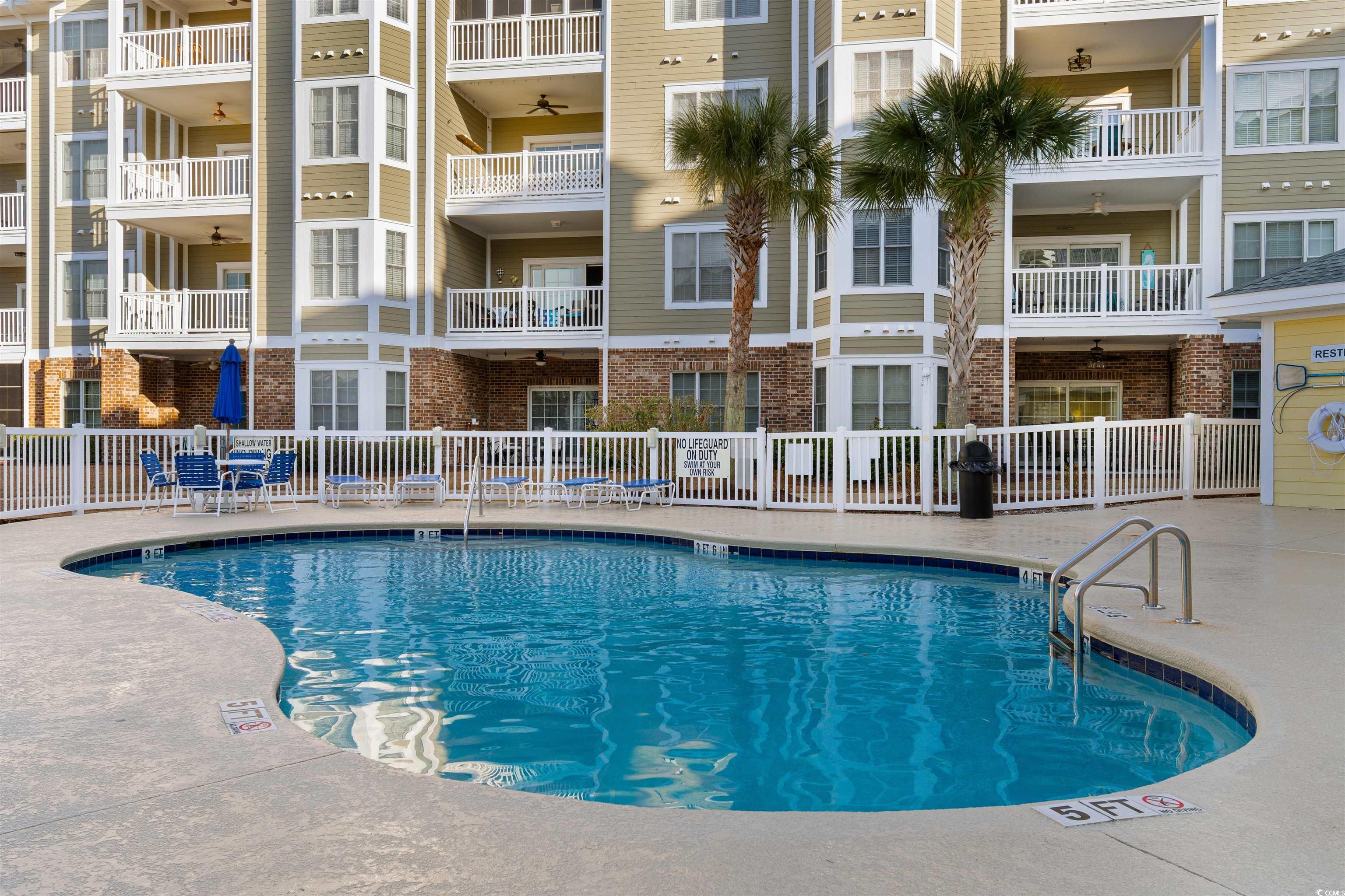 4875 Luster Leaf Circle, Unit 202 Myrtle Beach, SC 29577 - Photo 30 of 40 Pool featuring fence