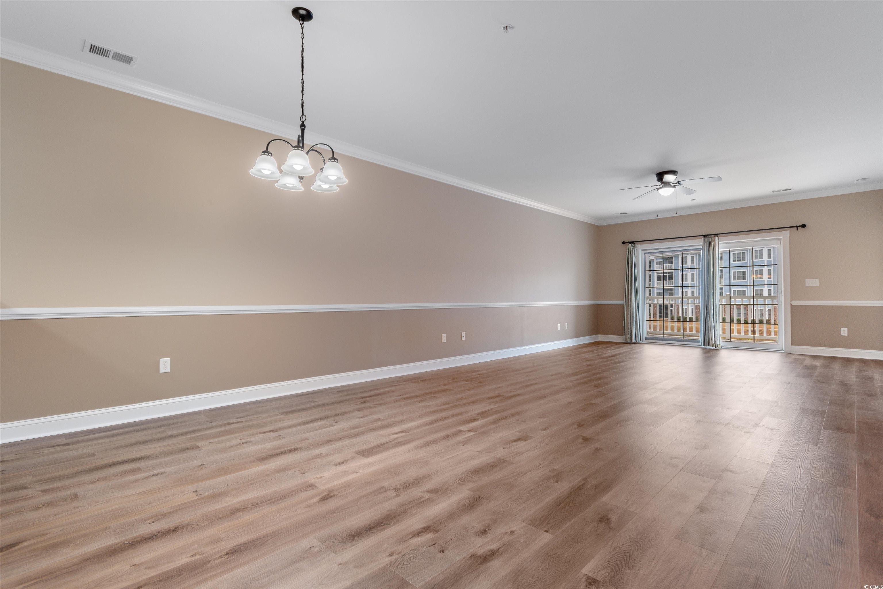 4875 Luster Leaf Circle, Unit 202 Myrtle Beach, SC 29577 - Photo 8 of 40 Empty room featuring light wood-type flooring, vis
