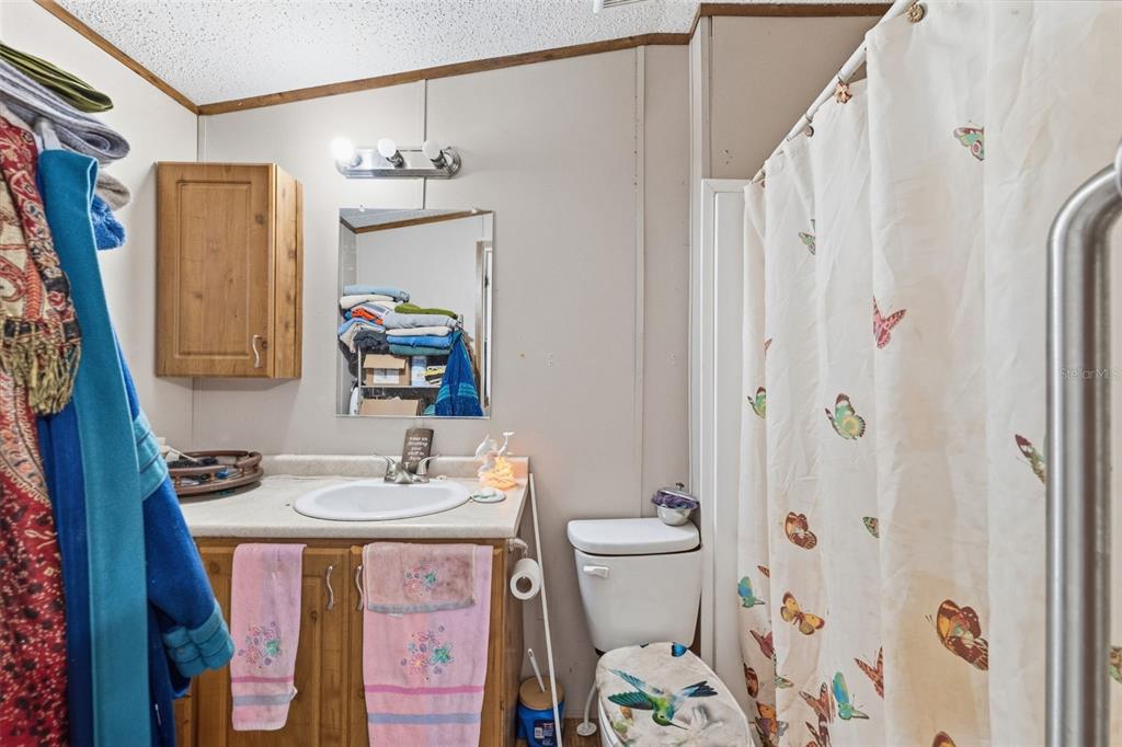 10501 East Patience Lane Inverness, FL 34450 - Photo 15 of 37 a bathroom with a sink toilet and shower