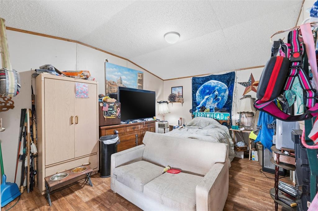 10501 East Patience Lane Inverness, FL 34450 - Photo 17 of 37 a living room with furniture and a flat screen tv