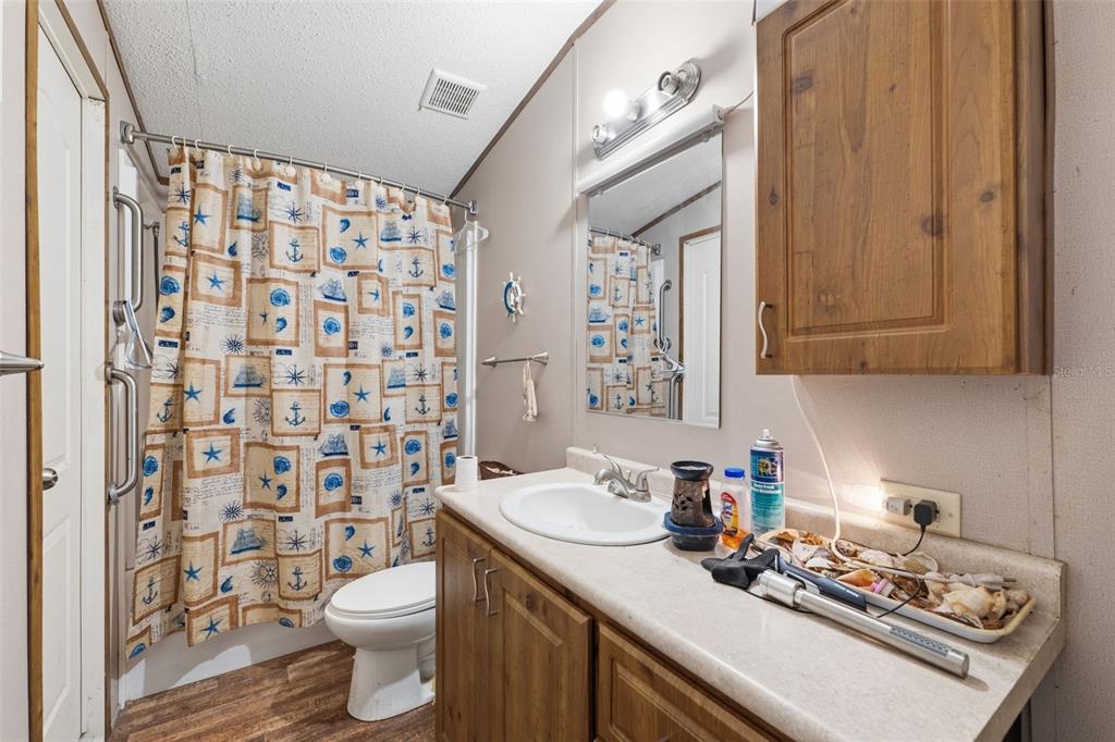 10501 East Patience Lane Inverness, FL 34450 - Photo 18 of 37 a bathroom with a sink toilet and shower