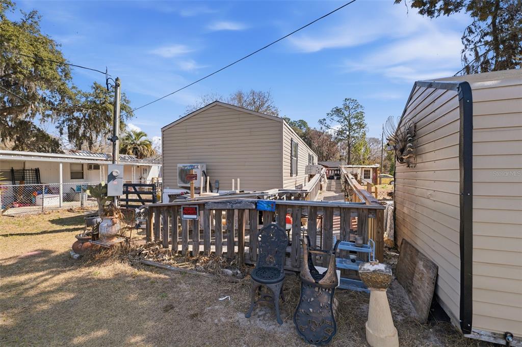 10501 East Patience Lane Inverness, FL 34450 - Photo 19 of 37 a view of a dinning table and chairs in patio of the house
