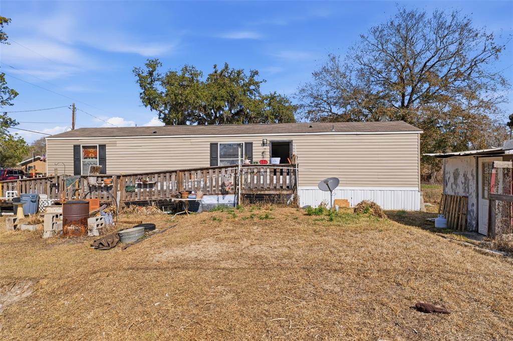 10501 East Patience Lane Inverness, FL 34450 - Photo 26 of 37 a view of a house with wooden fence