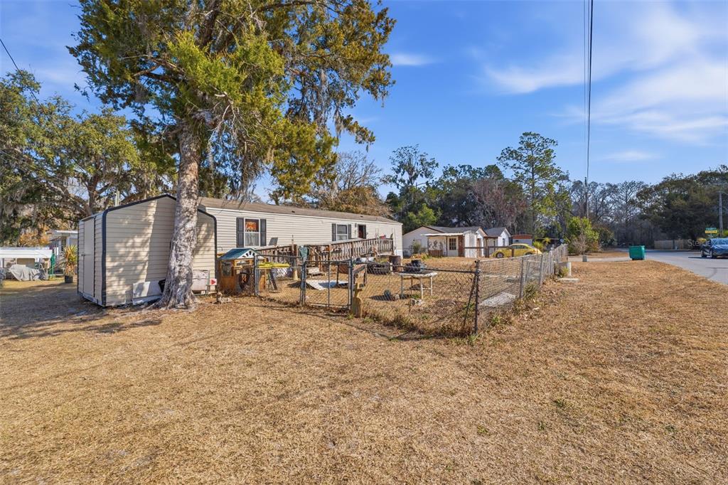 10501 East Patience Lane Inverness, FL 34450 - Photo 27 of 37 a view of a house with a yard and sitting area