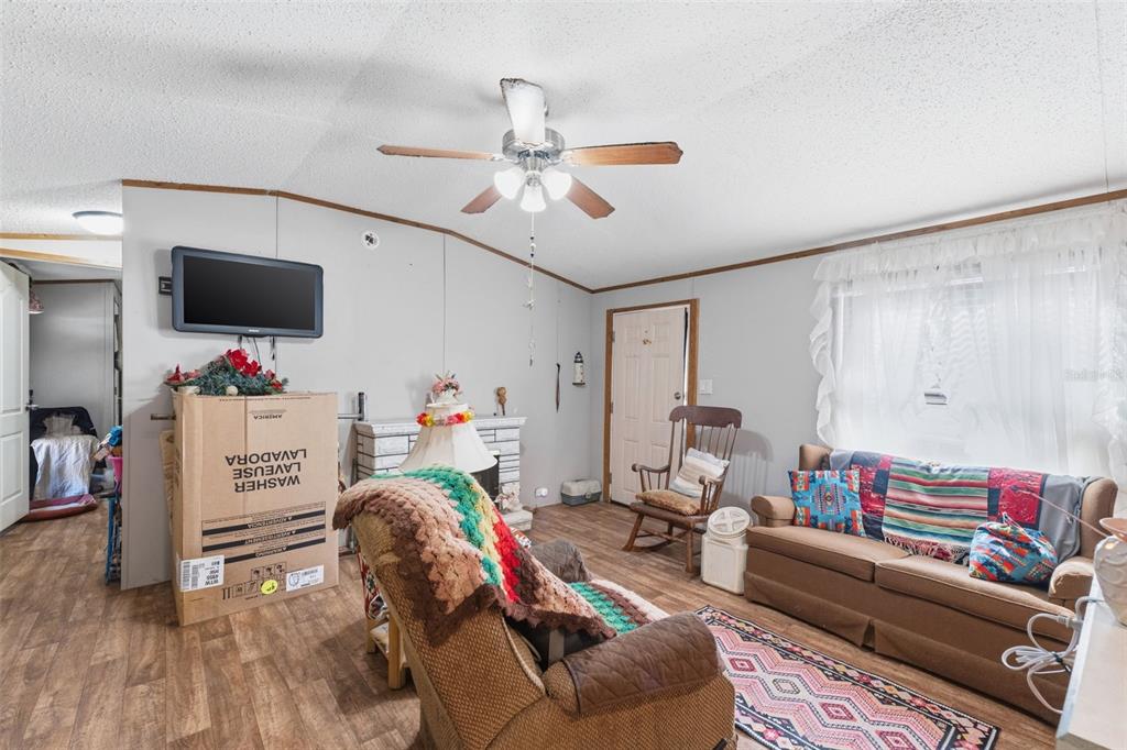 10501 East Patience Lane Inverness, FL 34450 - Photo 8 of 37 a living room with furniture and a flat screen tv