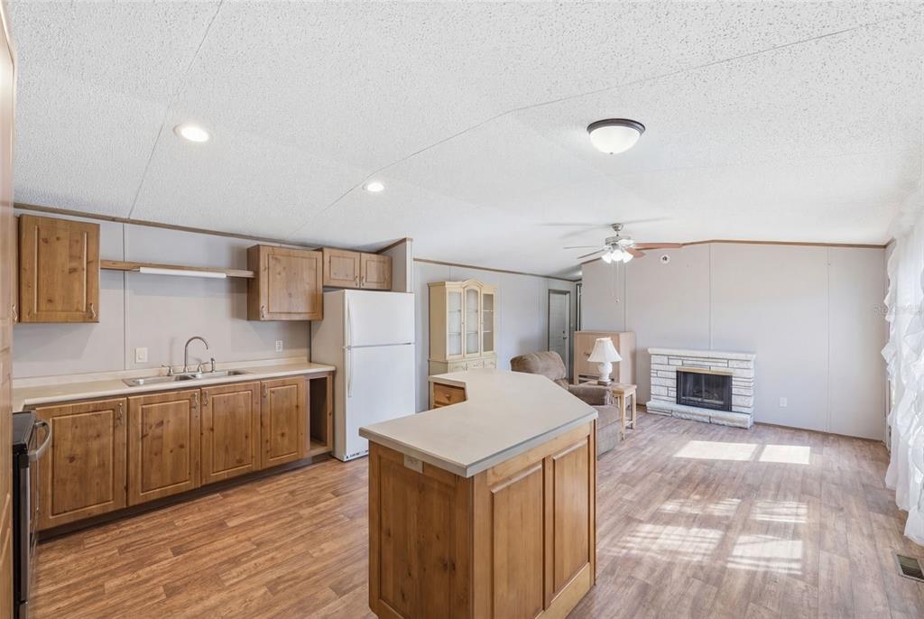 10501 East Patience Lane Inverness, FL 34450 - Photo 10 of 37 a kitchen that has a sink and a stove in it