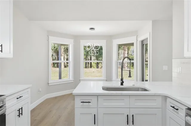 an empty room with closet and a ceiling fan