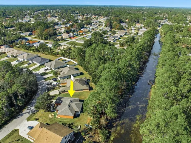 an aerial view of residential house with outdoor space