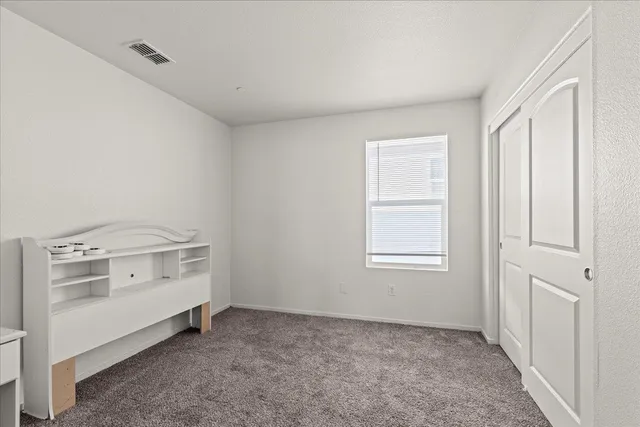 a bathroom with a sink mirror vanity and toilet
