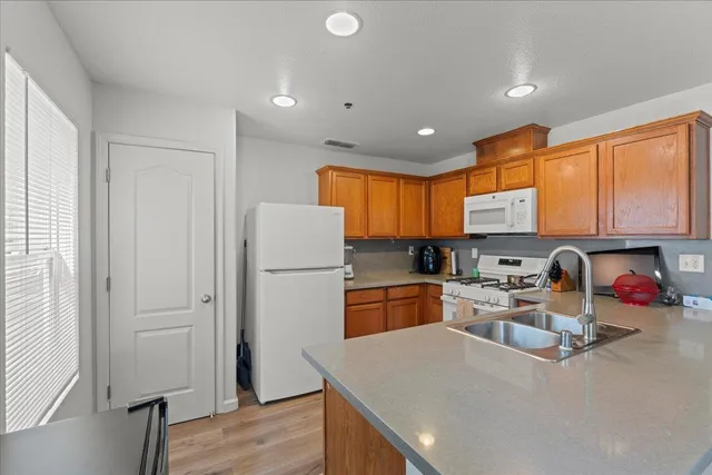 a kitchen with a sink stove and microwave