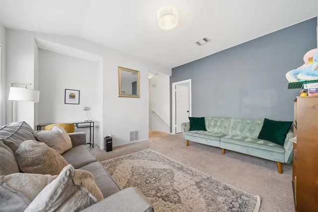 a living room with furniture and a couch