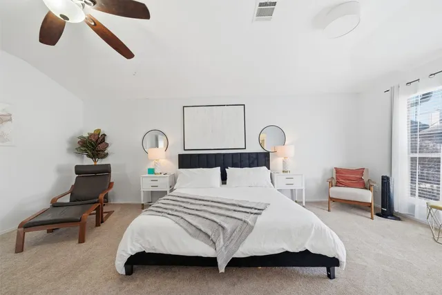 a bedroom with bed and a window