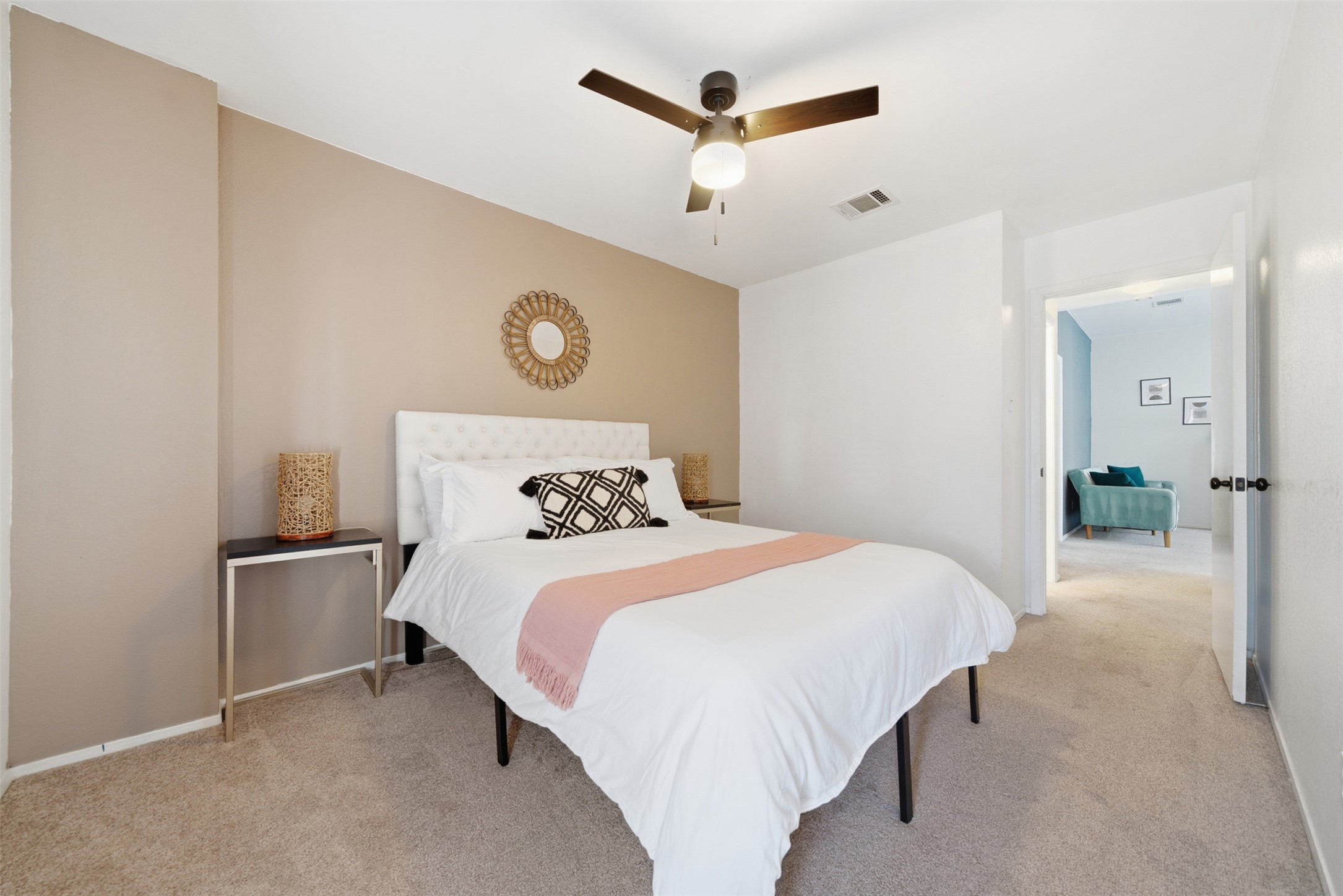 12906 Humphrey Drive Austin, TX 78729 - Photo 20 of 40 a bedroom with a bed and a chandelier