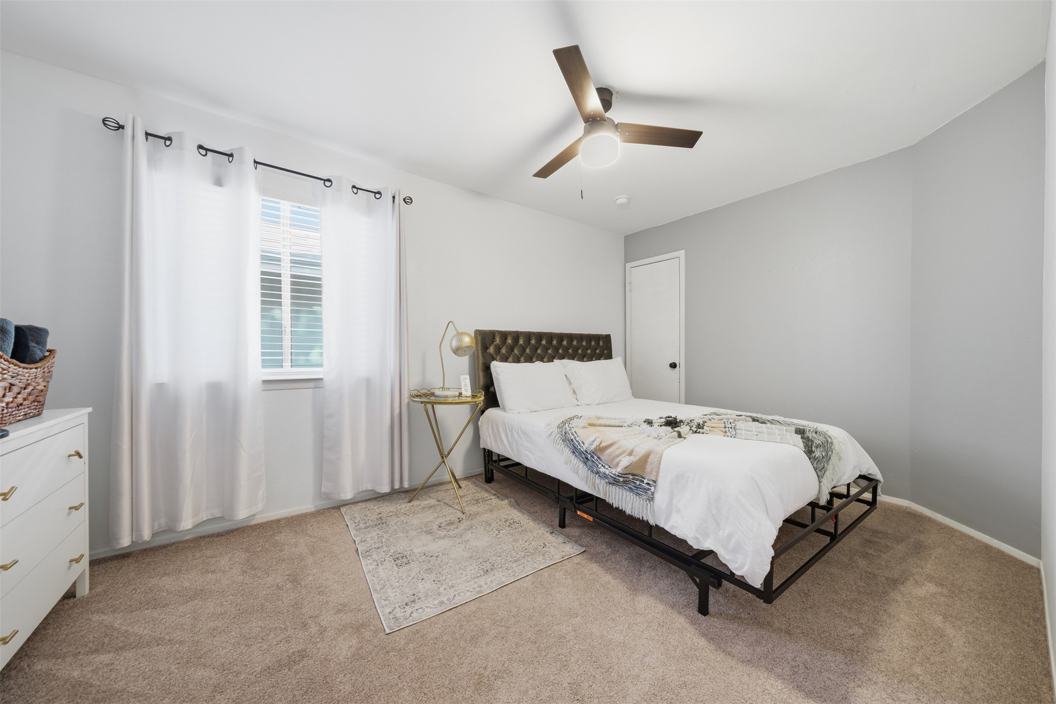 12906 Humphrey Drive Austin, TX 78729 - Photo 21 of 40 a bedroom with a bed and window