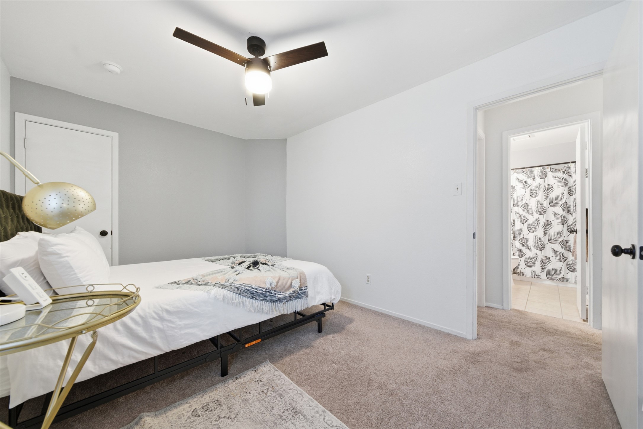12906 Humphrey Drive Austin, TX 78729 - Photo 22 of 40 a bedroom with a bed and cabinets