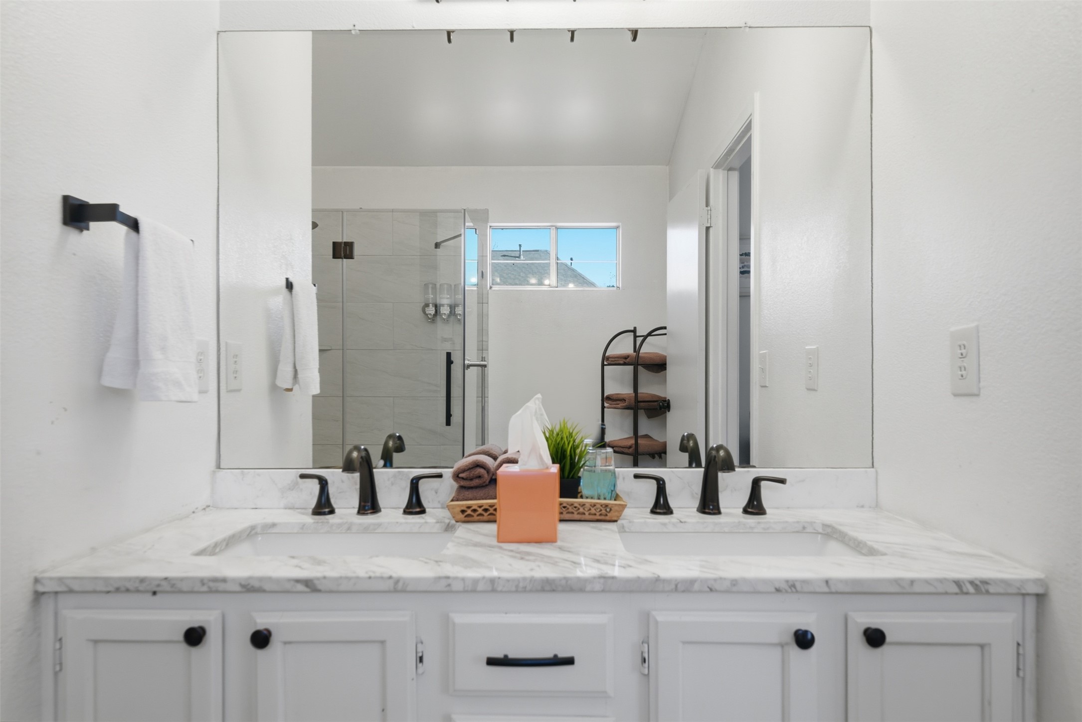 12906 Humphrey Drive Austin, TX 78729 - Photo 25 of 40 a bathroom with a granite countertop sink and a mirror