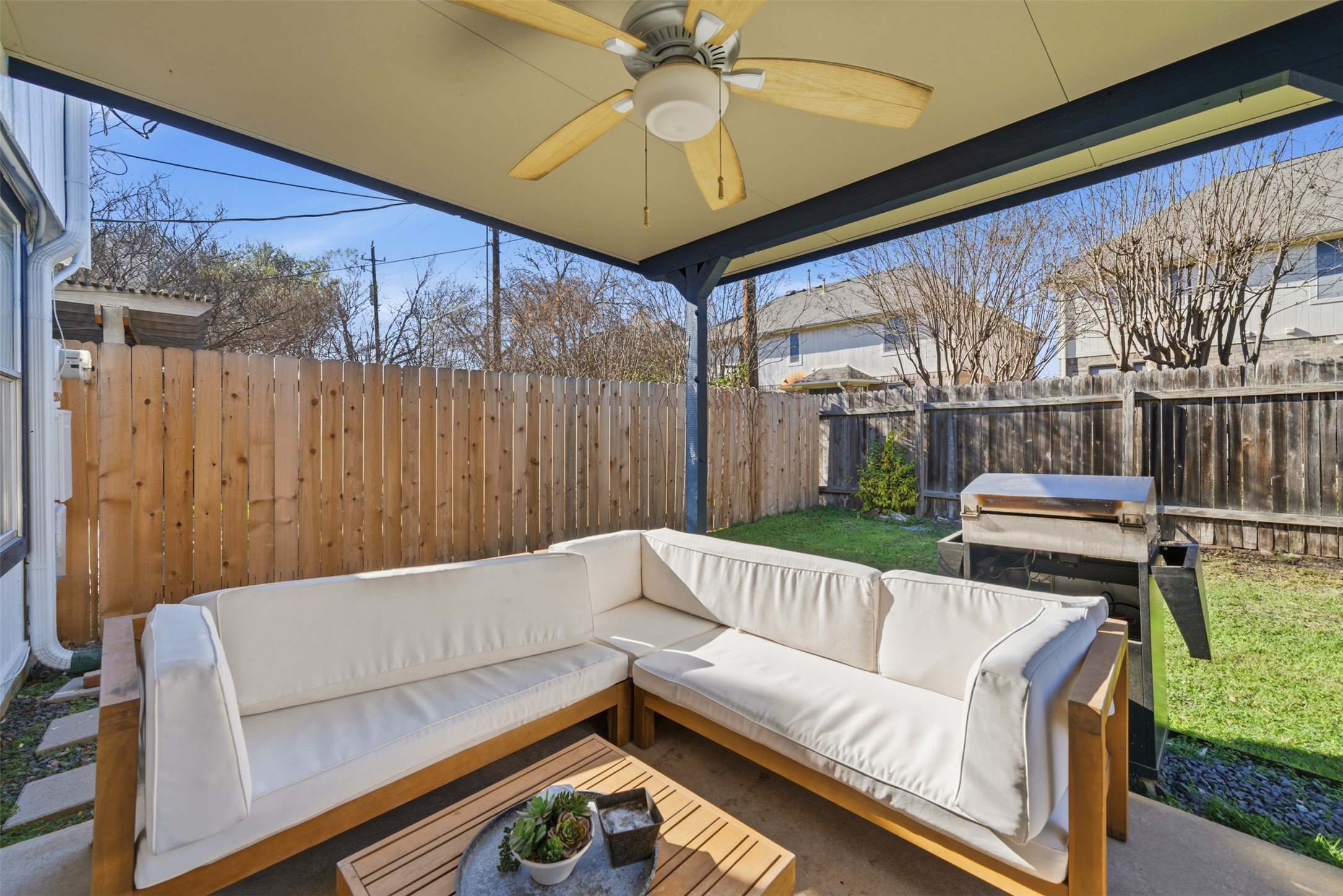 12906 Humphrey Drive Austin, TX 78729 - Photo 29 of 40 a living room with furniture and a floor to ceiling window