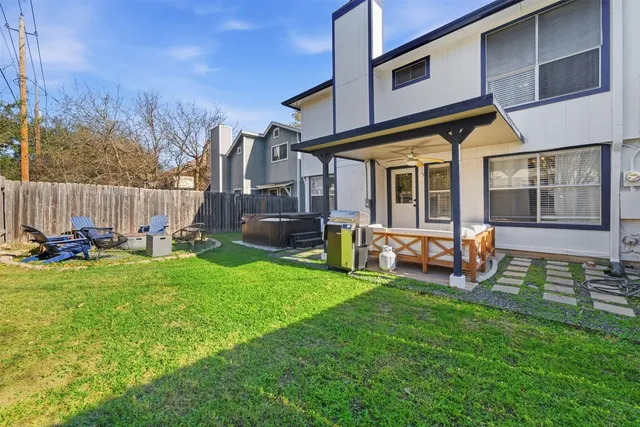 a view of a house with backyard and a slide