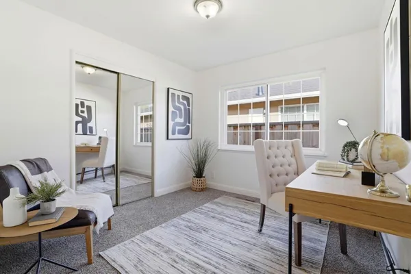 a workspace with furniture and a window