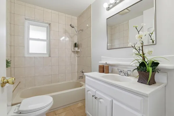 a bathroom with a sink a toilet and a bathtub