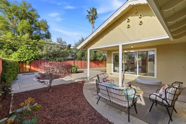 a view of a chairs and tables in the patio