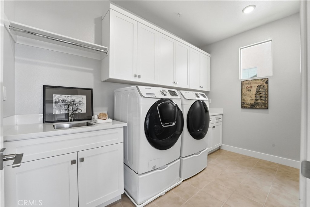 182 Scale Irvine, CA 92618 - Photo 28 of 61 This is not a closet with a washer in it. Full size Samsung front loaders, upper cabinets, a utility sink, and a hanging rod. Laundry day just got civilized.