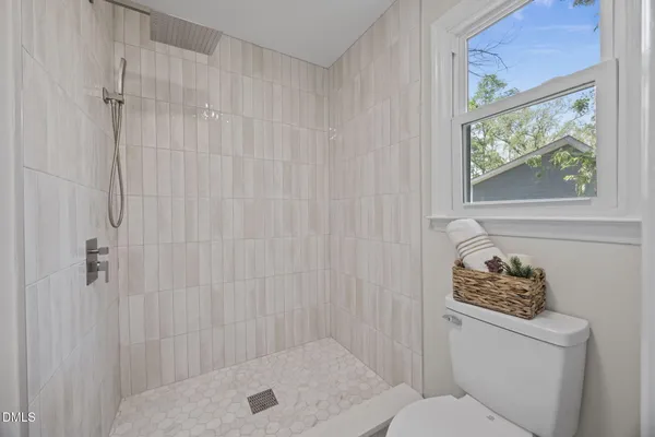 a bathroom with a bathtub and shower