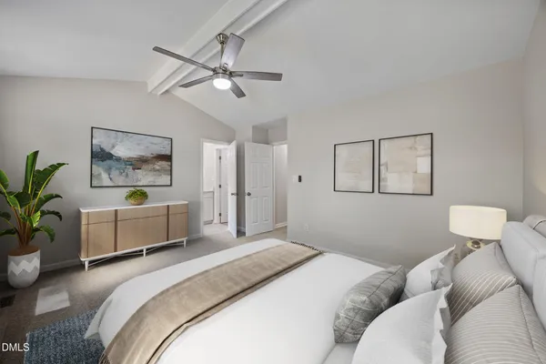 a bedroom with a bed and ceiling fan