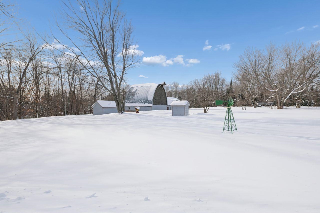 65915 Selke Road Mason, WI 54856 - Photo 29 of 33 Snowy yard featuring an outbuilding