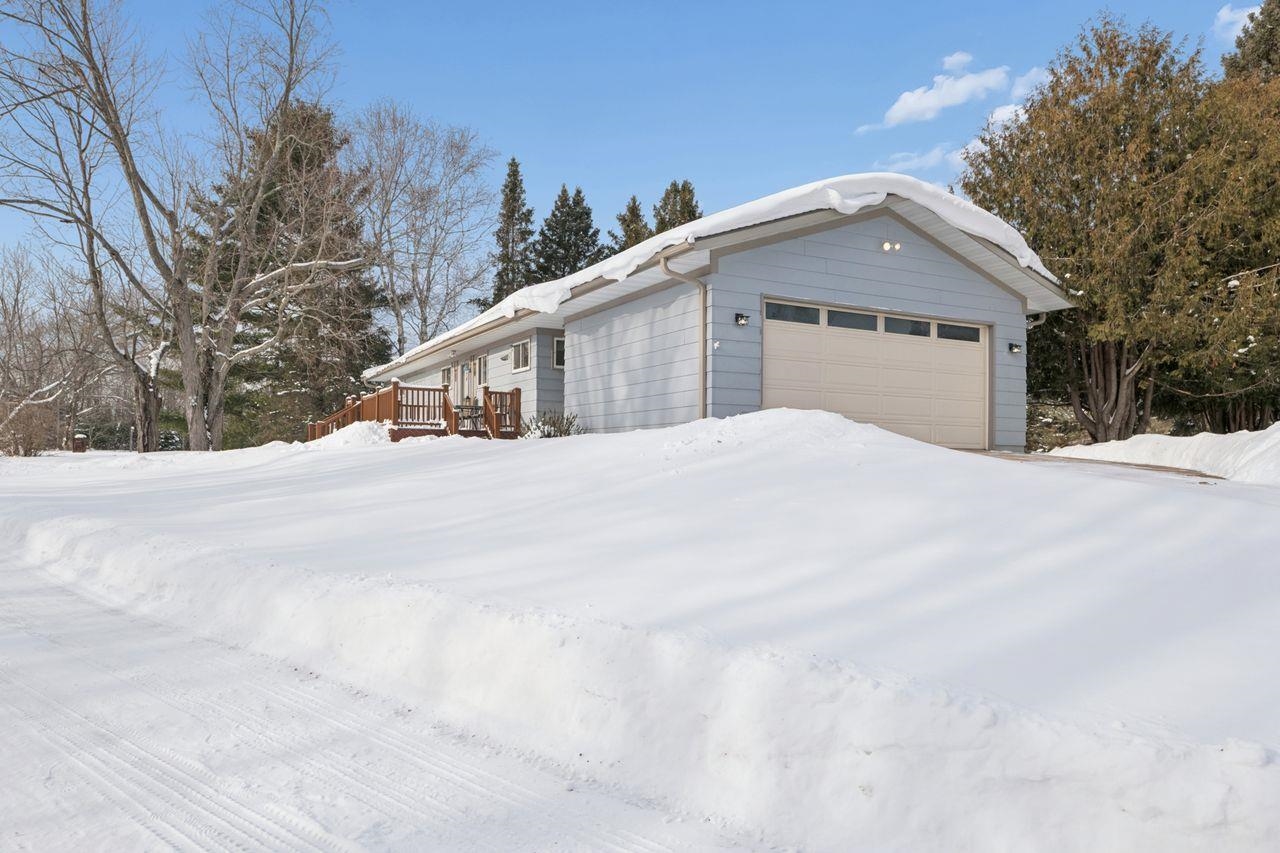 65915 Selke Road Mason, WI 54856 - Photo 32 of 33 Snow covered property featuring a garage