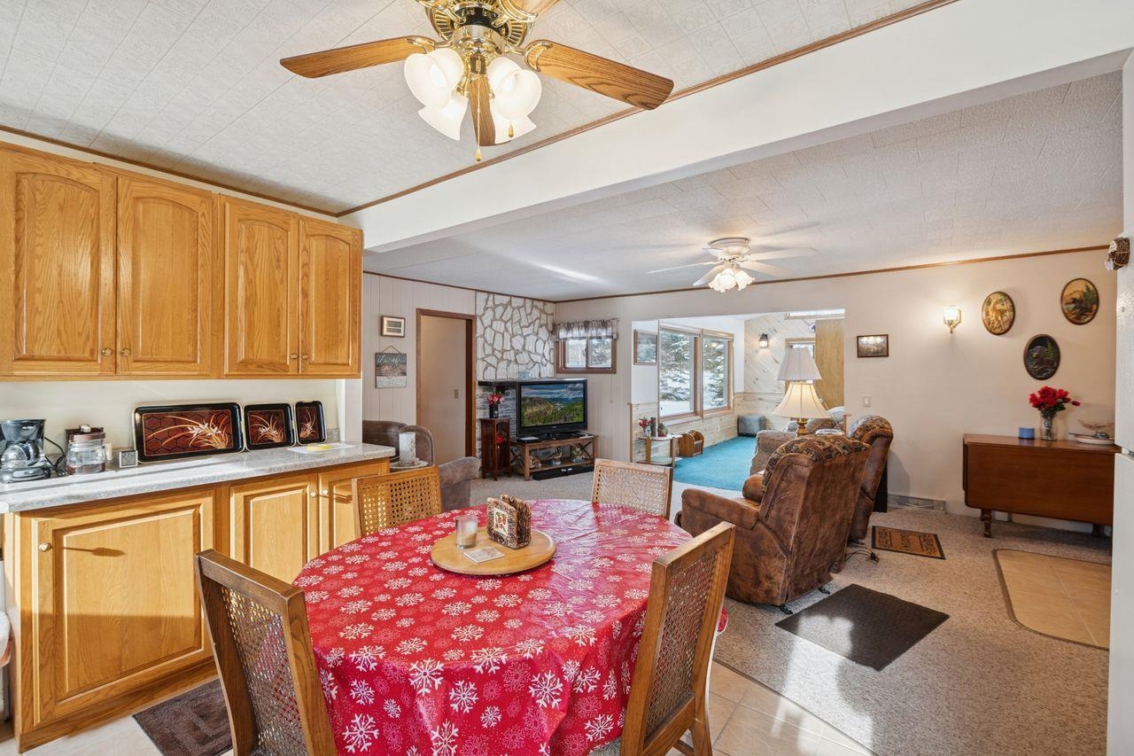 65915 Selke Road Mason, WI 54856 - Photo 10 of 33 Dining area featuring a ceiling fan