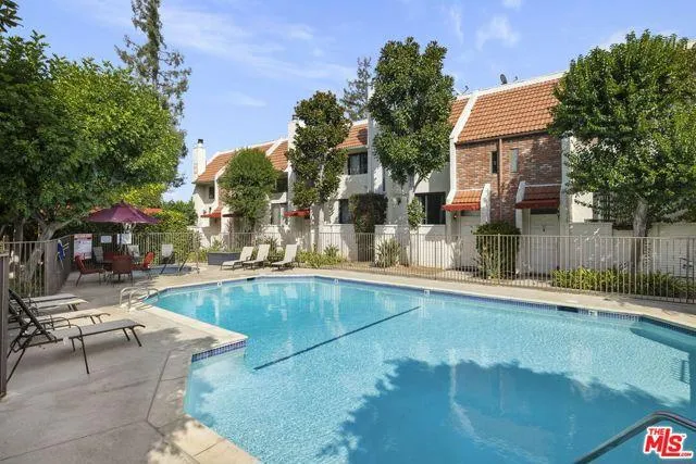 a view of a swimming pool with a patio