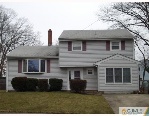 17 Magee Road Edison, NJ 08817 - Photo 1 of 10 a front view of a house with a yard