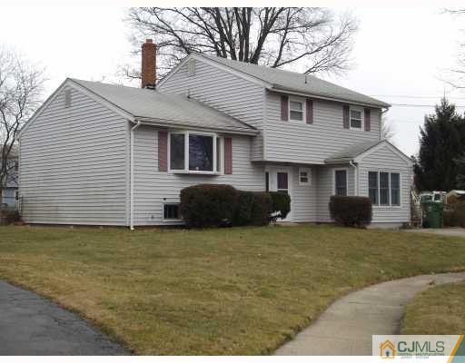 17 Magee Road Edison, NJ 08817 - Photo 10 of 10 a front view of a house with a garden